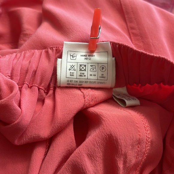 Pinkish Orange silk relaxed fit shorts. - Picture 6 of 6
